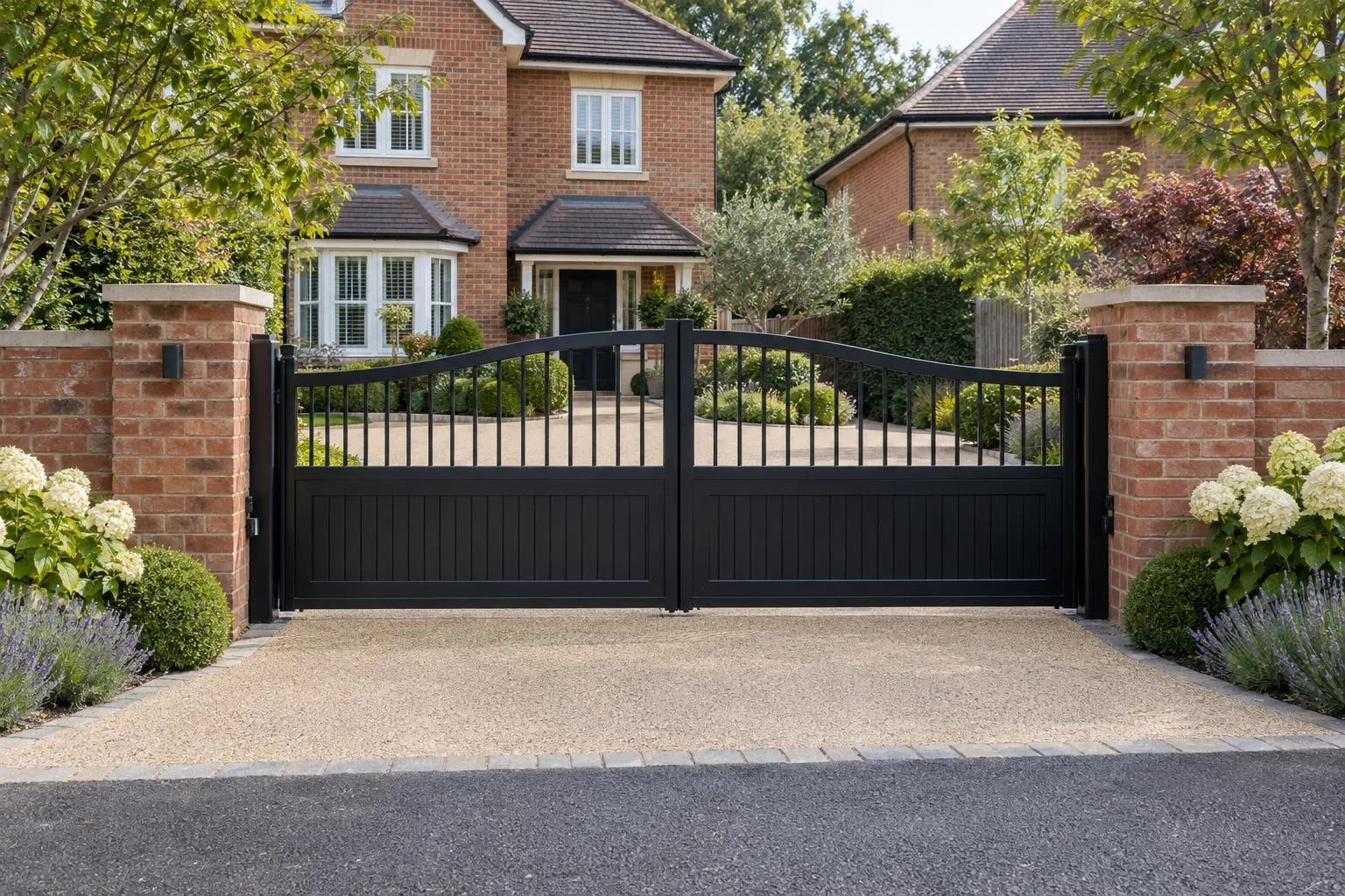 Grey composite sliding gate across a single drive beside a post-war brick semi in Bletchley Grey composite sliding gate across a single drive beside a post-war brick semi in Bletchley