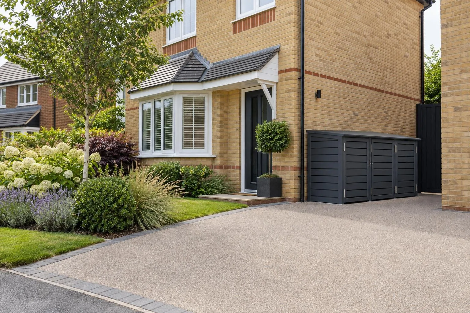 Two-bin composite store on a level paved pad beside a Cranfield estate house side path Two-bin composite store on a level paved pad beside a Cranfield estate house side path